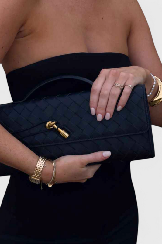 Melanie | Cartera de mano con lazo dorado